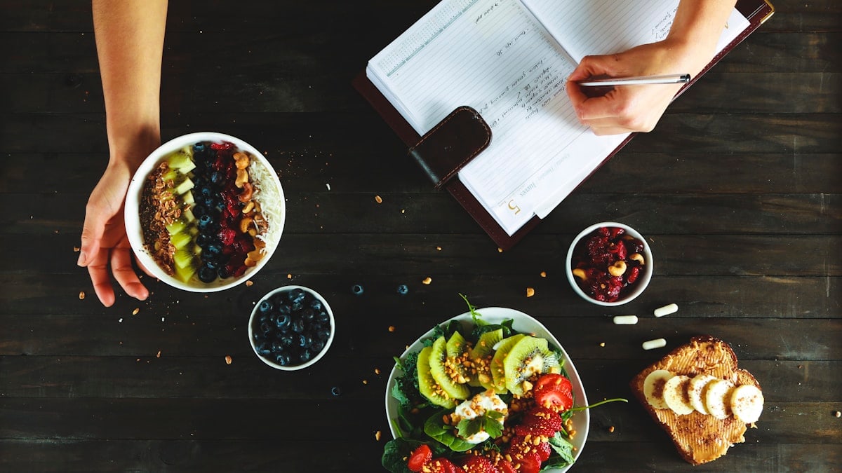 healthy food and notebook flat lay